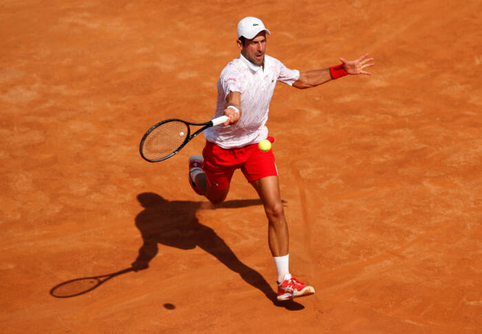 REUTERS/Clive Brunskill Novak Djokovic dari Serbia beraksi selama pertandingan putaran kedua melawan petenis Italia Salvatore Caruso
