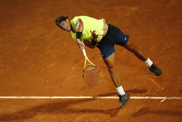 REUTERS/Clive Brunskill Rafael Nadal dari Spanyol beraksi selama pertandingan putaran kedua melawan petenis Spanyol Pablo Carreno-Busta